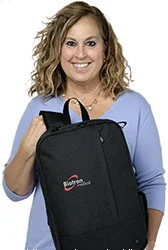 4imprint employee Sheryl holding the Kapston Pierce Laptop Backpack