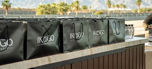 5 promotional bags on a counter