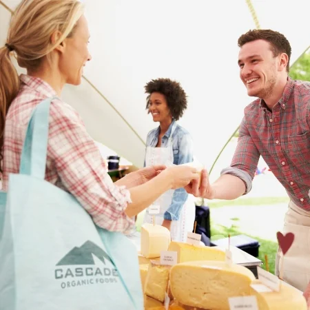 Selling products to a customer at the market.