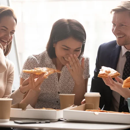 Group of people eating pizza