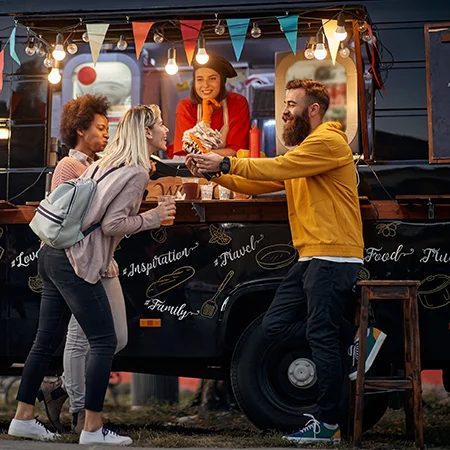 Group of friends eating at a food truck