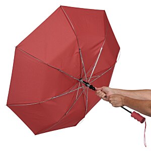 Additional Image 4 - a hand holding a red umbrella