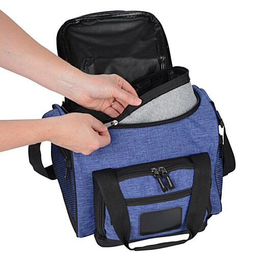 Additional Image 2 - a person opening a blue and black bag