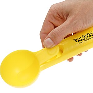 Additional Image 1 - a hand holding a yellow ball