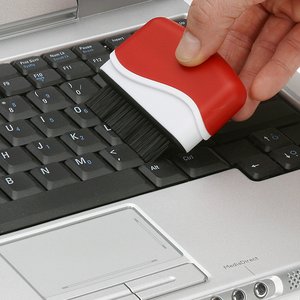 Additional Image 3 - a hand holding a red and white sponge on a keyboard
