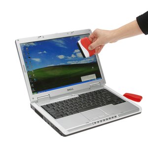 Additional Image 4 - a hand holding a brush to a laptop