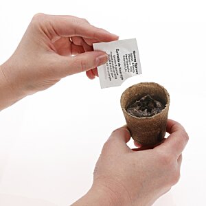 Additional Image 1 - a person holding a paper and a cup
