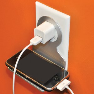 Additional Image 1 - a cell phone charging in a wall outlet
