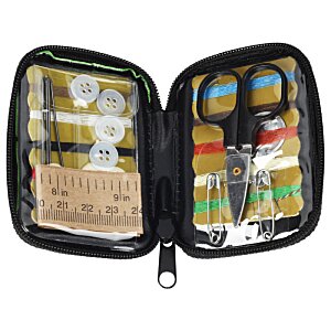 Additional Image 2 - a black case with a set of scissors and a small yellow object