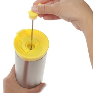 Additional Image 2 - a person holding a yellow tube with a needle