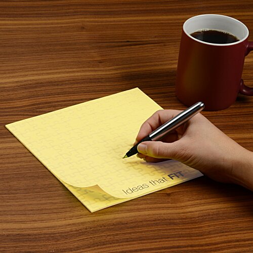Additional Image 2 - a hand holding a pen on a yellow paper