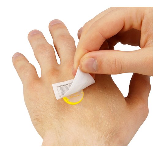Additional Image 2 - a person putting a small white object on a hand
