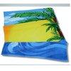 a beach towel with palm trees and blue water