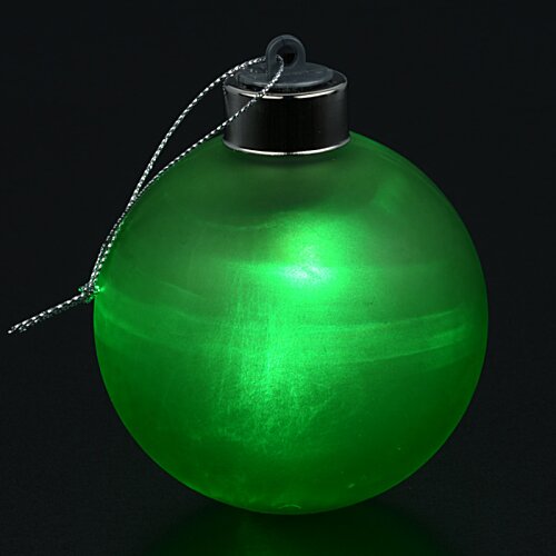 Additional Image 1 - a green round object with a string