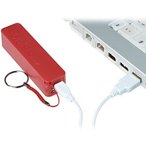 Additional Image 1 - a red rectangular object with a cord next to a white laptop