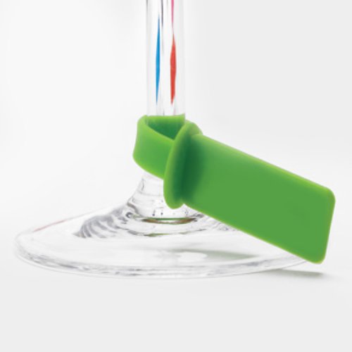 Additional Image 6 - a green plastic tag on a clear glass