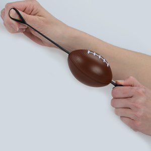 Additional Image 1 - a person holding a brown object