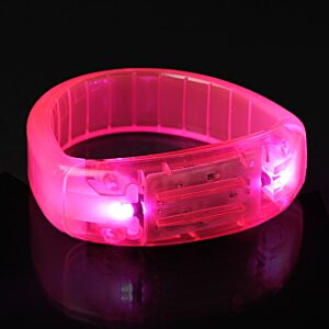 Additional Image 5 - a pink bracelet on a black surface