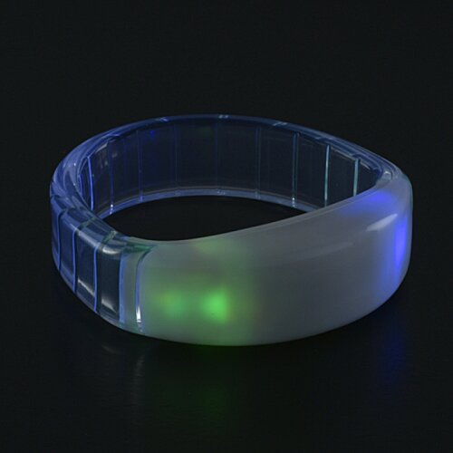 Additional Image 8 - a clear plastic ring with a green light