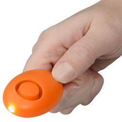 a hand holding an orange object