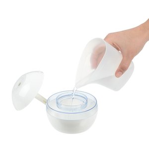 Additional Image 1 - a hand pouring milk into a bowl