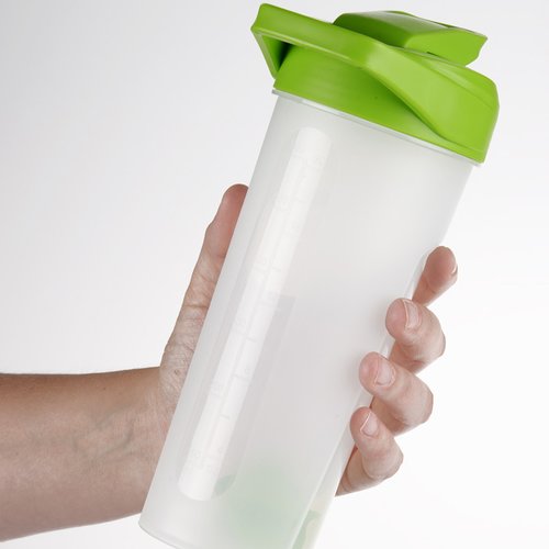 Additional Image 1 - a hand holding a white and green shaker