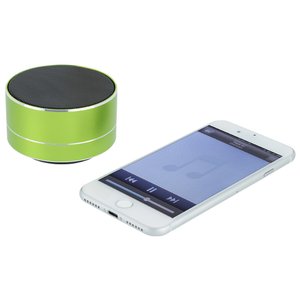 Additional Image 2 - a white cell phone next to a green cylindrical object