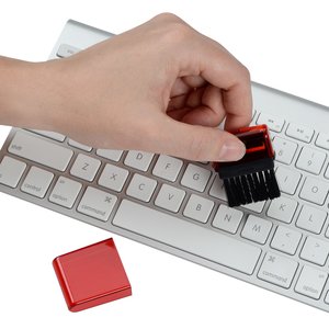 Additional Image 5 - a hand holding a black and red cube on a keyboard