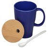 a blue mug with a wooden spoon