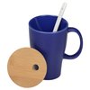 a blue mug with a straw and a wooden object