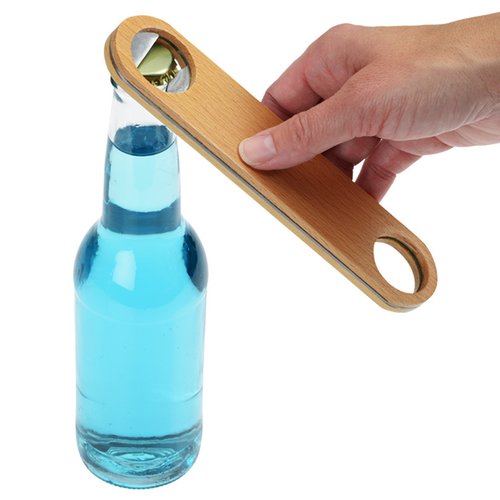 Additional Image 2 - a hand holding a wooden object over a bottle
