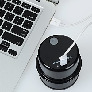 Additional Image 4 - a black round object with a white cord on top of it