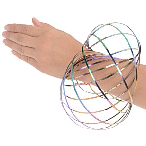 Additional Image 1 - a person's hand with a colorful spiral object on their wrist