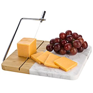 Additional Image 3 - a cheese and grapes on a cutting board