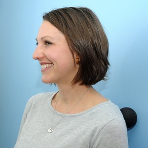 Additional Image 1 - a woman smiling in a grey shirt