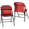 a pair of red folding chairs