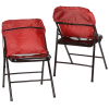 a pair of red folding chairs