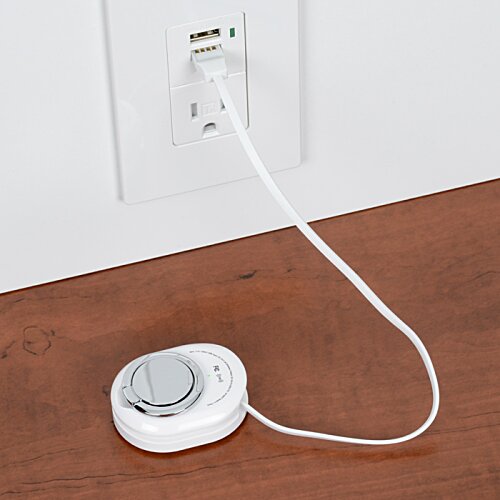 Additional Image 4 - a white round device with a cord plugged into a wall outlet