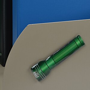 Additional Image 4 - a green flashlight on a table