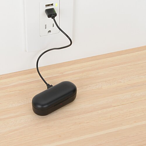 Additional Image 1 - a black object with a cord plugged into a wall