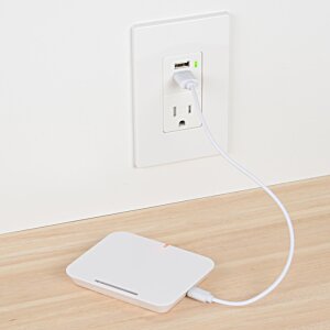 Additional Image 3 - a white rectangular object with a cord plugged into a wall outlet
