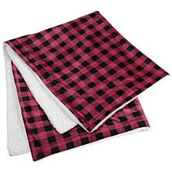 a stack of red and black checkered papers