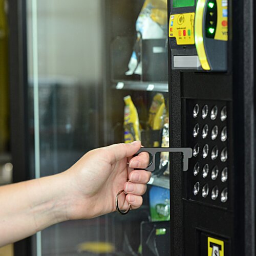 Additional Image 5 - a hand pushing a vending machine