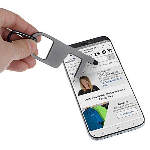 Additional Image 2 - a hand holding a keychain over a cellphone