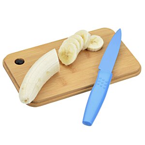 Additional Image 4 - a knife and a banana on a cutting board