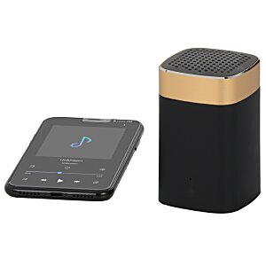 Additional Image 3 - a black and gold speaker next to a black cell phone
