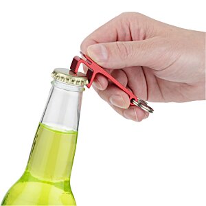 Additional Image 6 - a hand opening a bottle
