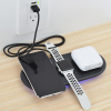 Additional Image 2 - a smart watch and phone on a charger