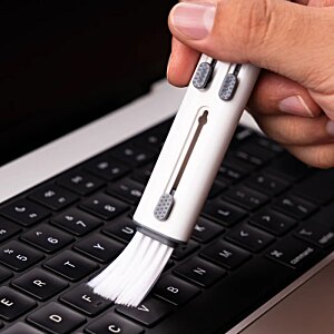 Additional Image 2 - a hand holding a white brush over a keyboard
