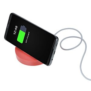 Additional Image 3 - a phone charging on a wireless charger